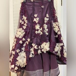 - Purple skirt with matching boots and belt-